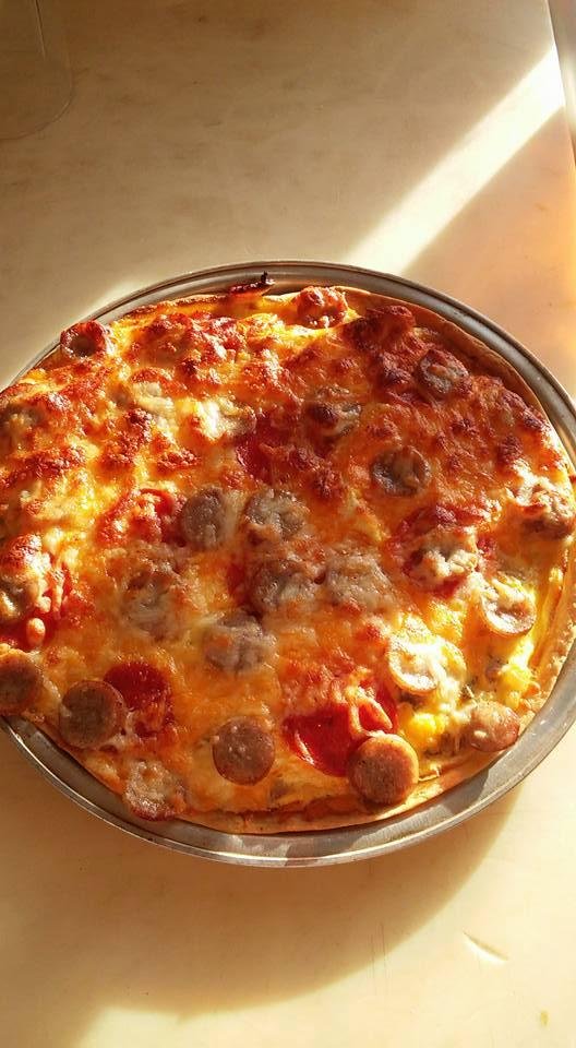 Breakfast pizza. Scrambled eggs and all the trimmings!!! YUM!
