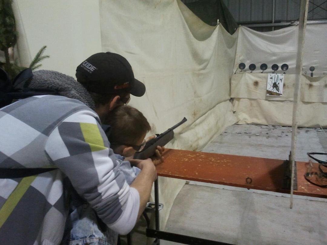 Daddy teaching logan to shoot
