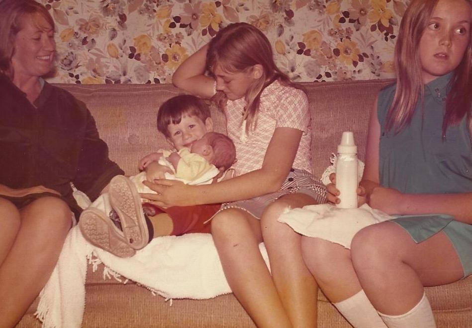 Merry, Milt 3 years old holding Annie Davis Chin 3 days old Kathi Brown 11 years old , and Debbie Chaves 10 years old whose ? birthday is today (hoping she'll get to feed Annie),