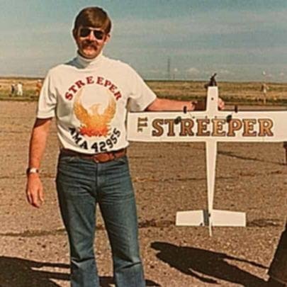 Here's the fearless Pylon Racer and his trusty weapon in racing outfit. This was taken in 1975 at the Eastern Idaho Aeromodelers flying field, which was on the old runways North of I-15, across from FMC. Later FMC decided