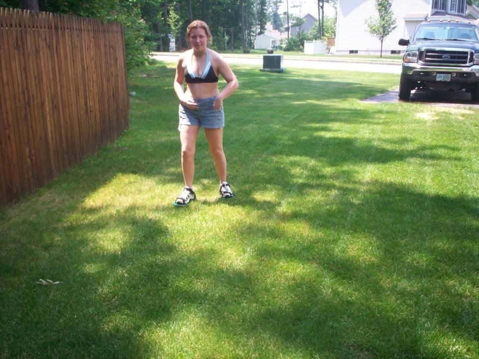 Erica thatching my lawn the old way 2001.
