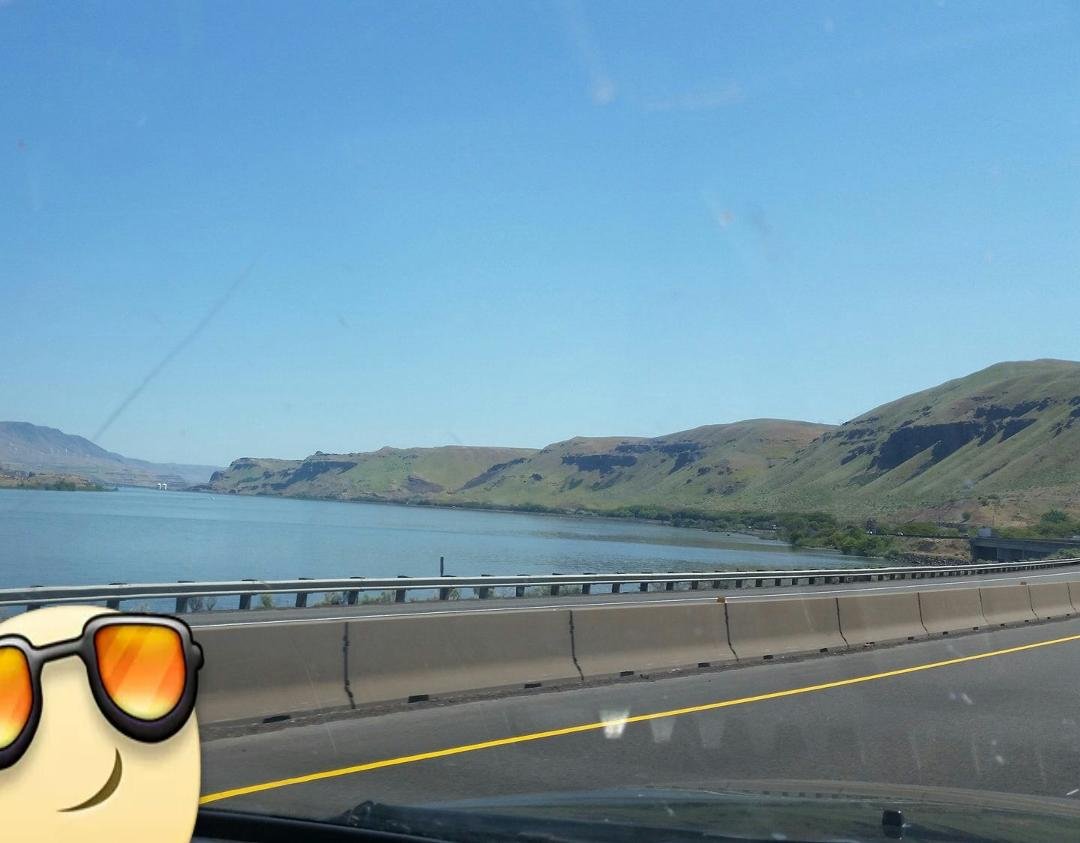Mouth of the Deshutes River joining into the Columbia River. Lots of fishermen out with their boats.
