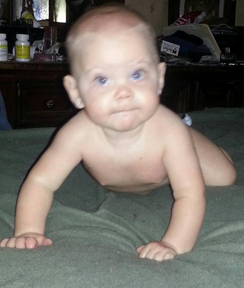 Baby girl helping Grandma work shes very determined to "help" me on the laptop