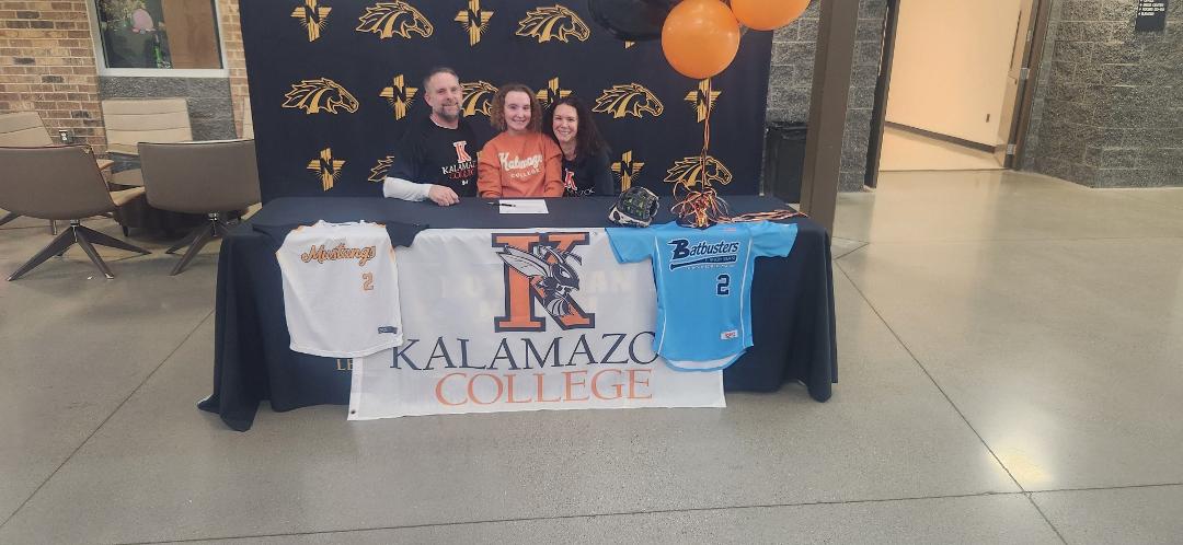 One of my beautiful granddaughters signing her committment lettee to attend Kalamazoo college and play some softball and get her a premed degree