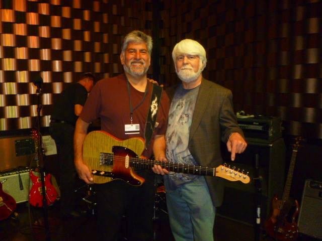 I am standing on stage at Bear River Casino with Dr. Frank Fisher and the stunning tele style guitar that he hand built and then gifted to me. The entire guiter, especially the neck and his hand wound pick-ups, fit my body
