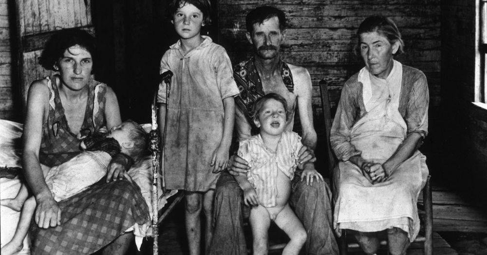 White Privilege
Hale County, Alabama — 1935
The devastating effects of the Depression are frighteningly visible in this 1935 shot of Alabama Cotton Sharecropper Bud Fields and his family.