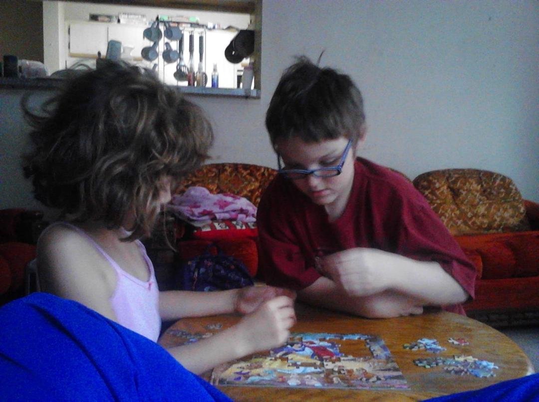 Dylan and Natalie working together on a puzzle....without fighting!!!!