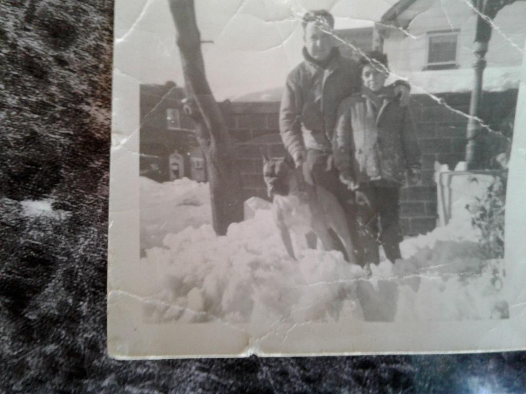 1961 with my uncle Tom and his dog Brandi in front of 542 28st 3 to 4 ft of snow