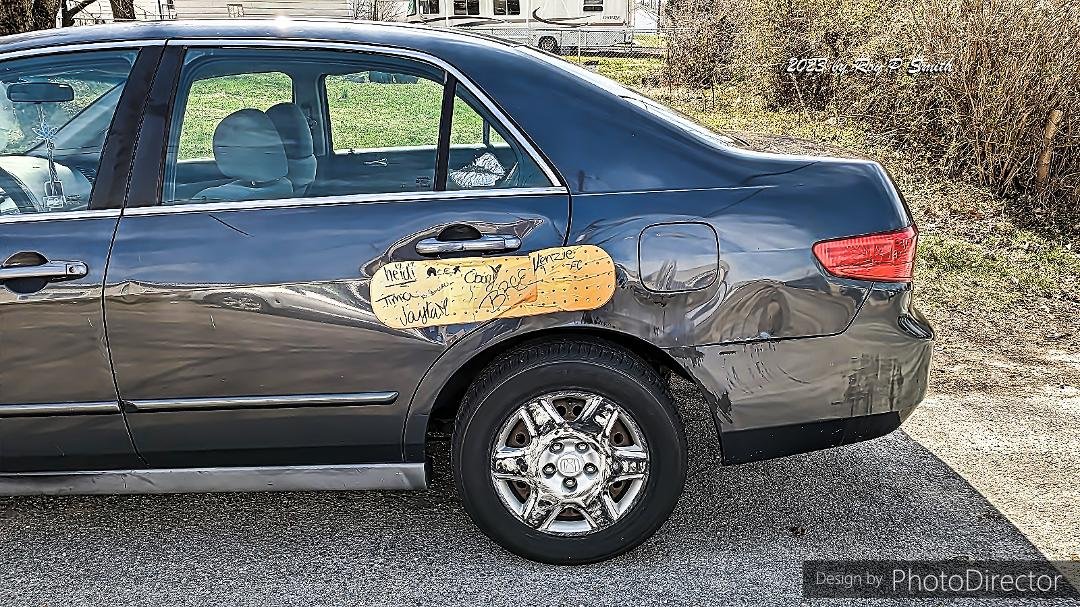 A car owner with a sense of humor finds a way to "patch up" a fender-bender.