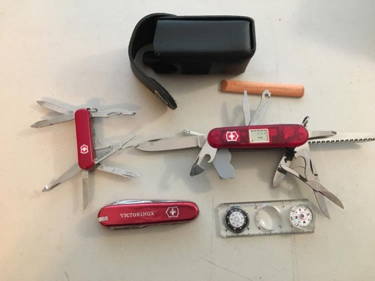 Can you spot the fake Swiss Army Knife? The one with the blades closed is actually a Chocolate Candy I got for Christmas. Can’t bring myself to open it.
