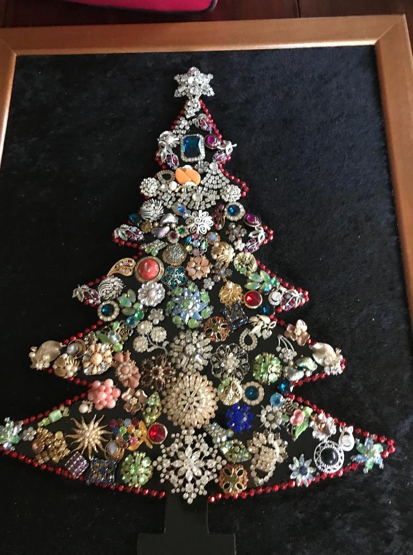 Besides cleaning my house from top to bottom I have been trying my hand at taking 2 of my aunts & grandma's old jewelry. I may have wrecked the antique things I added to this. Hope my grandma isn't looking down at me fro