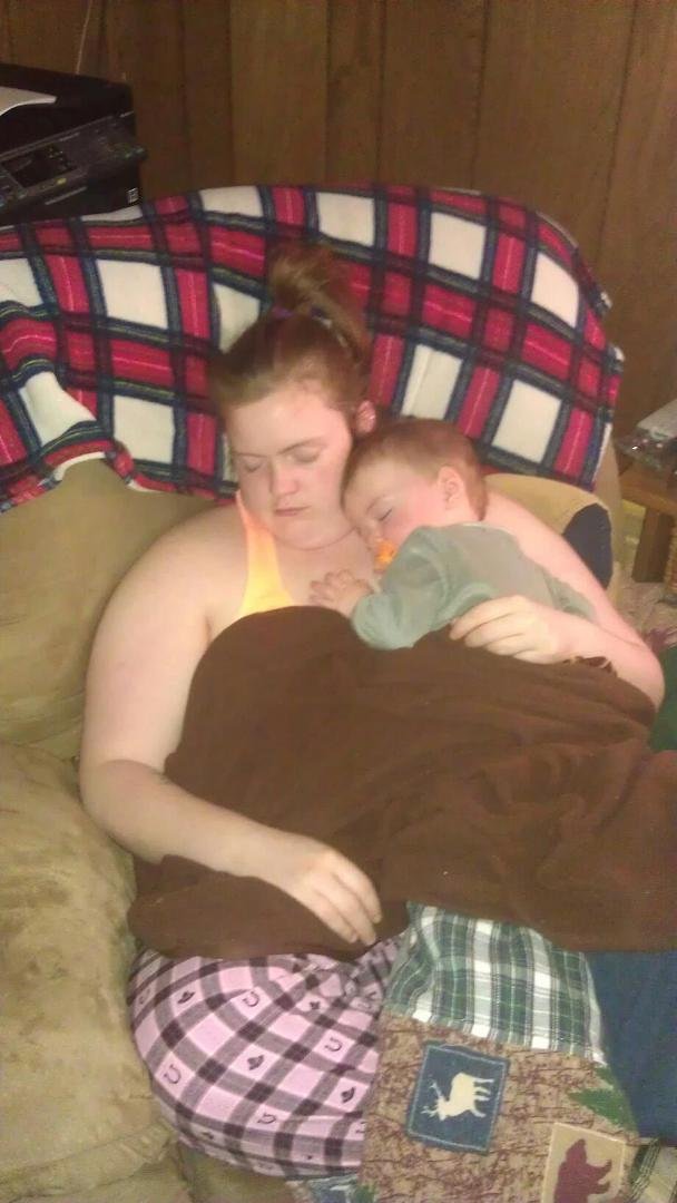 Eliza being a good Mom with Christopher.Up with Bailey all night. Nap time...