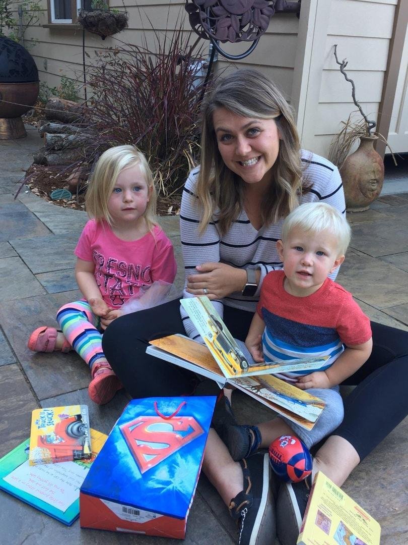 Had a great time visiting two greatgrandchildren in Morgan Hill, Katie and Ben. Their Aunt Allie showing the books we got them and Katie had her Pink Fresno State shirt on I got her.