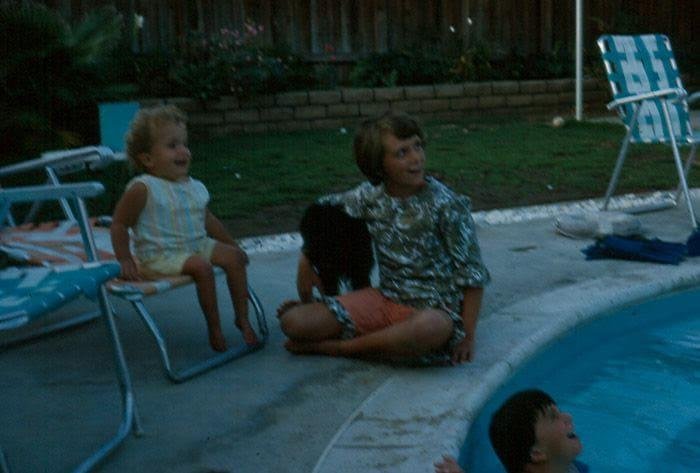 My sister Stacey 3 or 4 yrs old sitting by the pool with our Aunt Cindy & family dog shadow! I believe that is me in the pool? Stacey swam like a fish like all of us kids. Always had so much fun swimming playing Marco polo