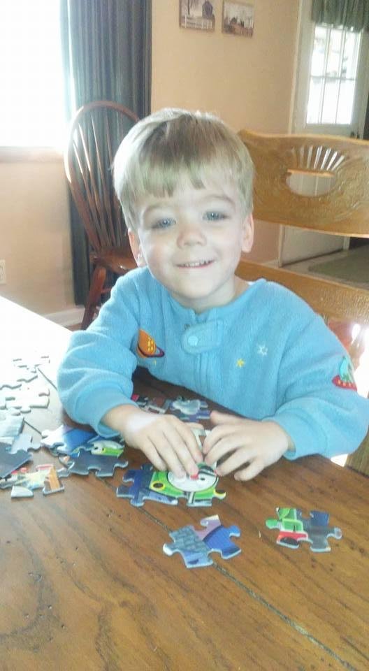 Henry doing his puzzles he is on number 3.