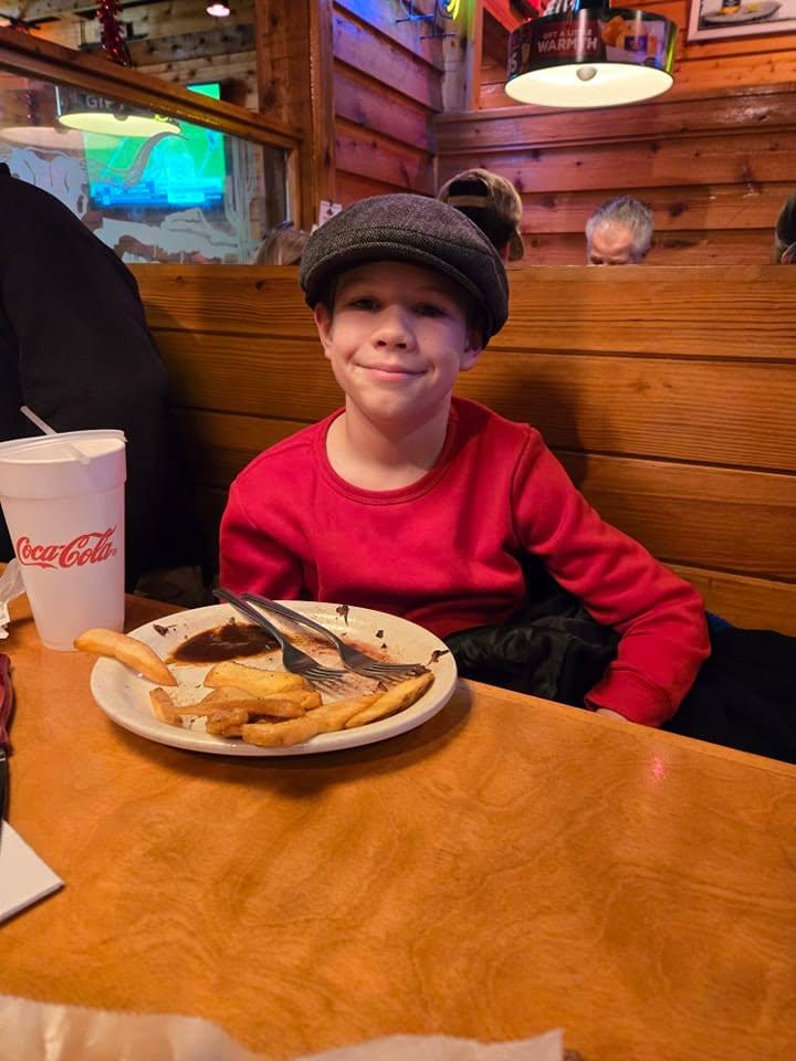 My grandson with his Papa's hat on last night at last night's celebration dinner for his Mom's 34th Adoption Anniversay! Her Mom and I have celebrated her special day every year since December 13, 1990!