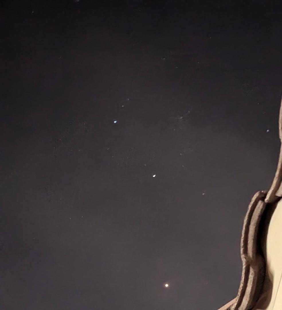 Is it possible that I have captured an image of three planets approaching alignment? Consider the star patterns surrounding each planet, which reveal remarkably similar patterns aligned with the three celestial bodies. Whil