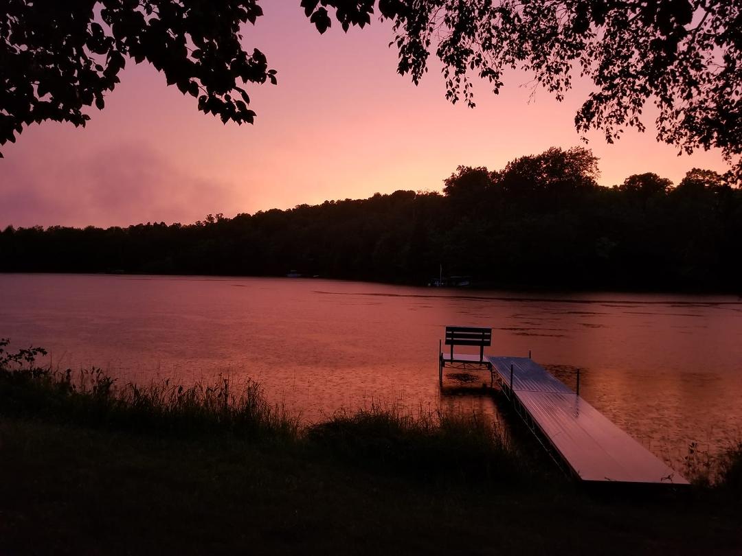 A rosey sunset following a bad storm at our lake cabin...1st night here. LOVE this place !!