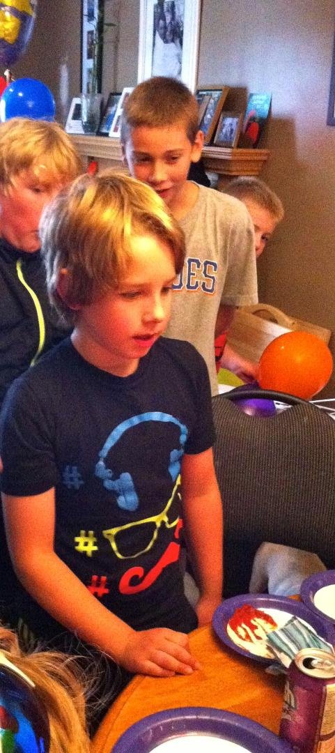 Rylan preparing to blow out his birthday candles.