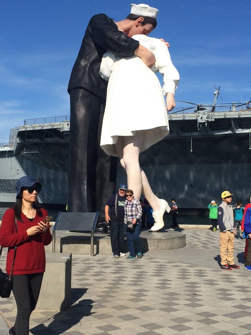 San Diego sailor/nurse  statue at end of WWII.Sits by Midway ship. Impressive