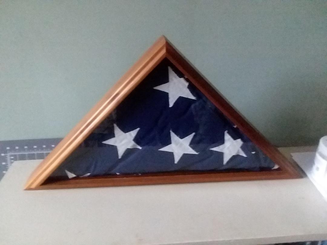 Always decluttering, organizing.   Found then properly displayed uncle Johnny's veteran flag.  Gone since 1968.