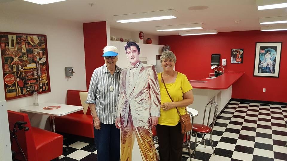 Mom and I visiting Elvis in the Coke  lounge at her new home at Brookdale in Oregon.