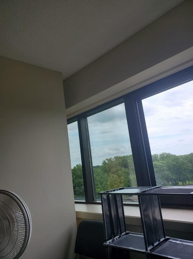 This is the window the black appears to be metal I don't know if it's magnetic but I don't see a way to hang curtains. Can't hang on whitish part