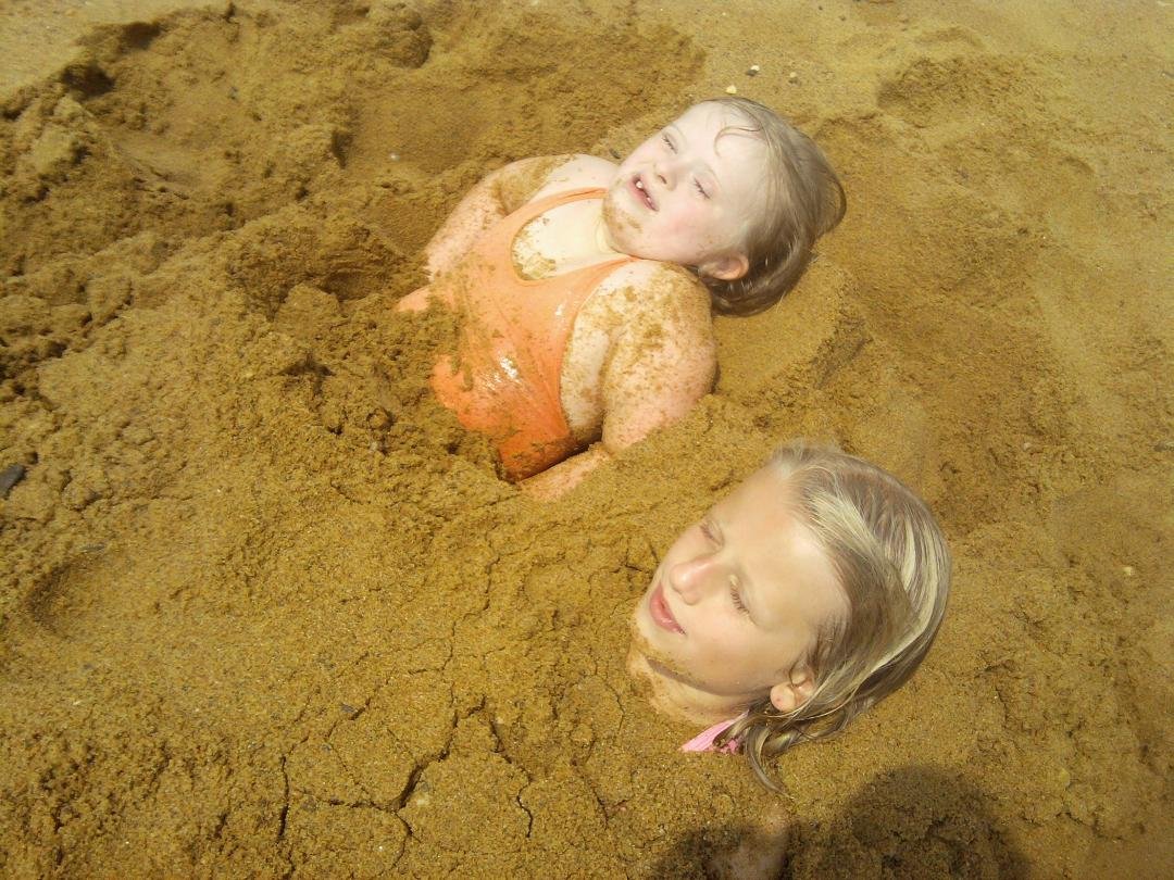 AUGUST 24,2012 HOPE N CAITLIN being buried in the sand...