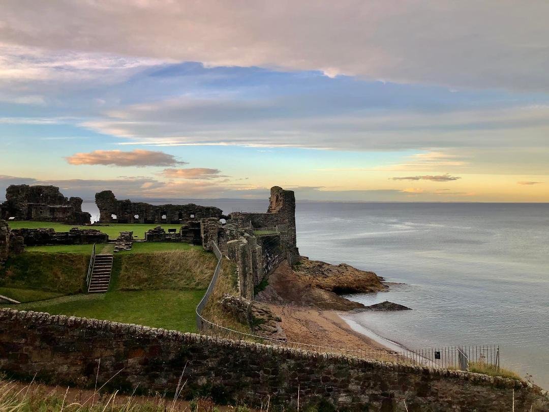 The ruins of St. Andrews Castle on a North Sea sunset.
