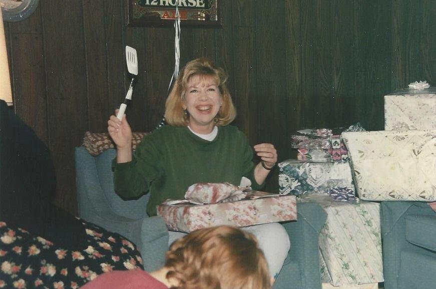 Lady and fly swatter...lord knows I didn't cook at age 40+....LOL!