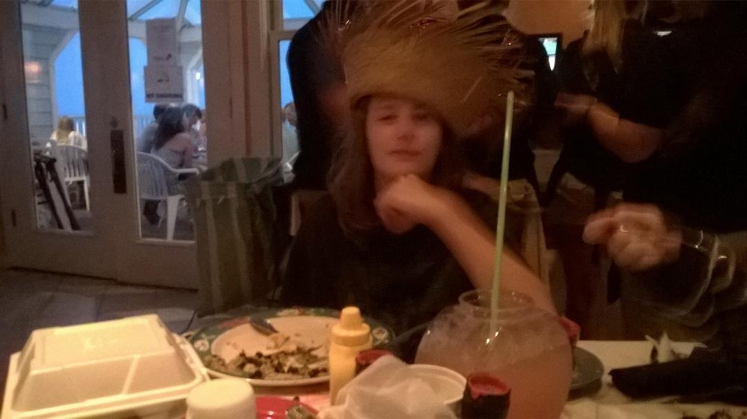 At the beach and Mango Mikes celebrating Sarah's birthday with a hat and drinks in fishbowls.