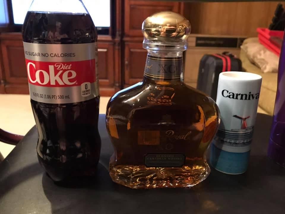 Happy New Year to everyone. I am starting to celebrate the new year now. With Diet Coke, tall glass of ice, a large Carnival Cruise Lines shot glass, and a bottle of Crown Royal (cured in a old cask that had Cognac in it).
