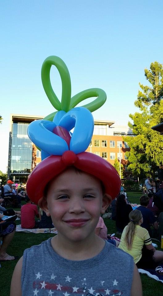 Levi with a propeller hat at Puyallup concert.