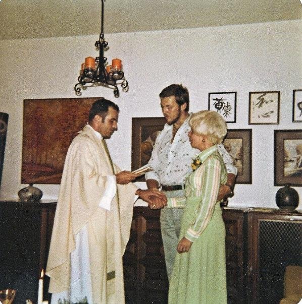 On our 15th wedding anniversary we renewed our wedding vows.  We had recently finished a Marriage Encounter course, and wanted to renew our vows.  The priest was a friend, and this photo was taken in our living room, in Bau