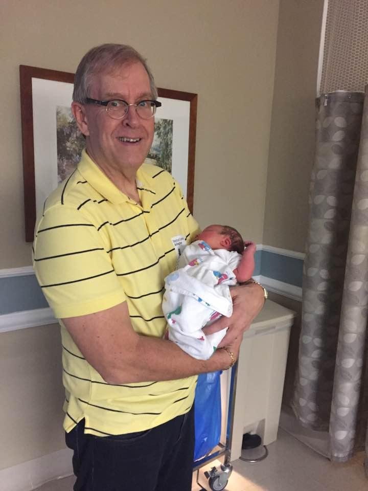 Lucky Papa holding Eva Grace