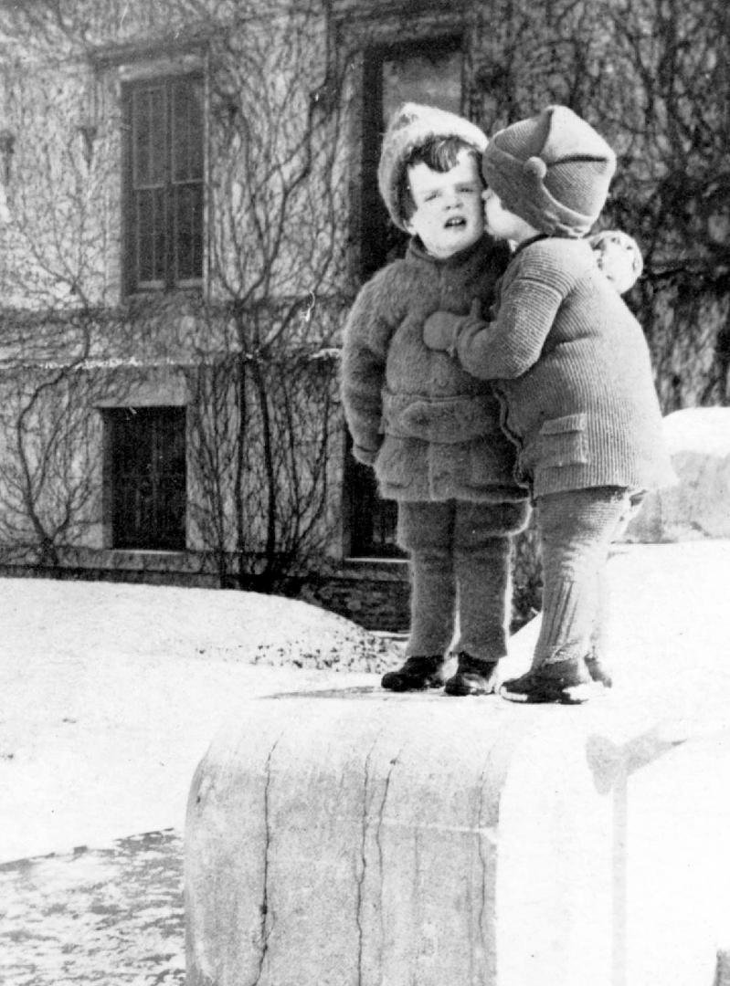 My mother bussing a strange-looking tyke. Binghamton, c 1918.