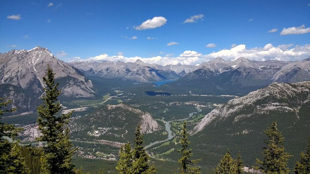 Banff, Canada....Mark and l took the cable car to the top of the mountain. Great views. The Bow River heads back onto the mountains and onto a lake. Just beautiful.