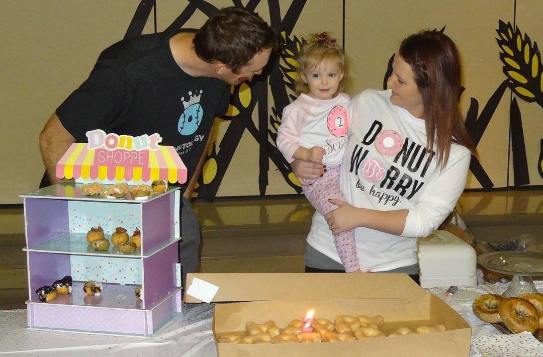 Ready to blow out the candle on the donuts!