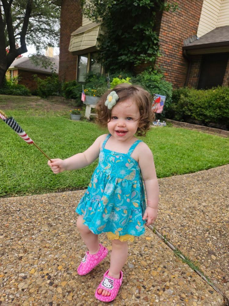 Our little patriot. Walked all over the yard waving her flag and exclaiming "FLAG".