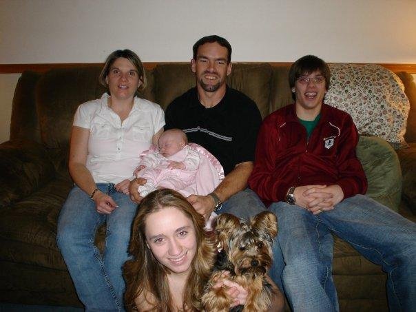 My daughter Lisa , hubby Andy, grandson Tommy, granddaughters (baby) Lillie and Amy holding her dog Barbie.
