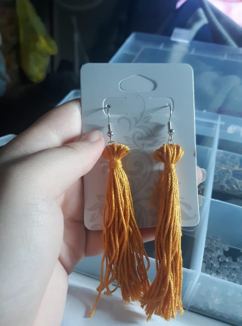 I made my first pair of tassel earrings I wish they looked a bit better but I like how they turned out