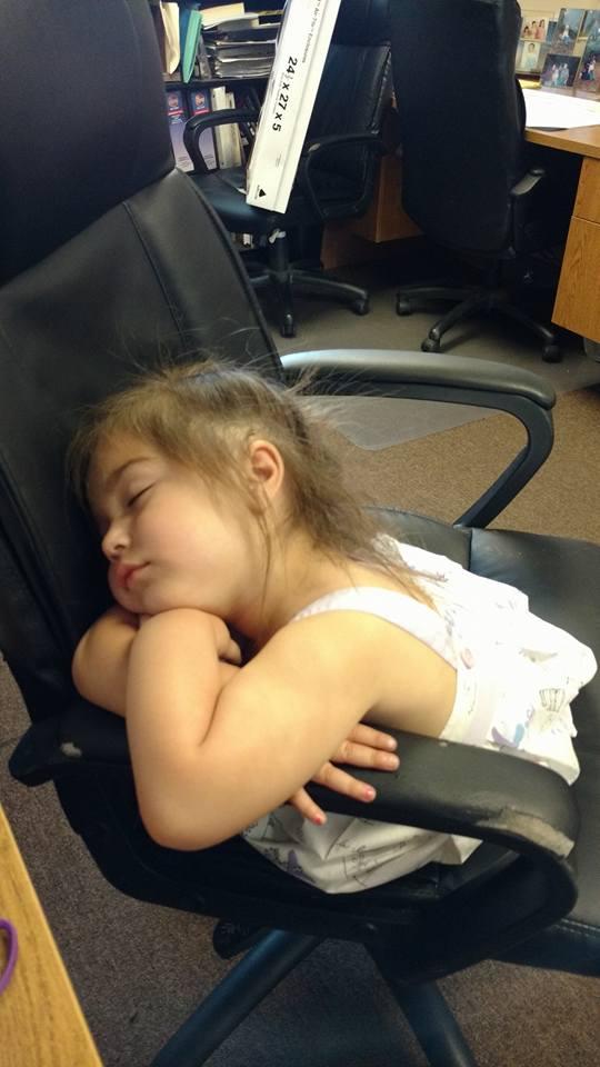 This is my youngest granddaughter of nine. 5 boys and 4 girls First day at the office working should I fire her for sleeping, or should I give her a warning.