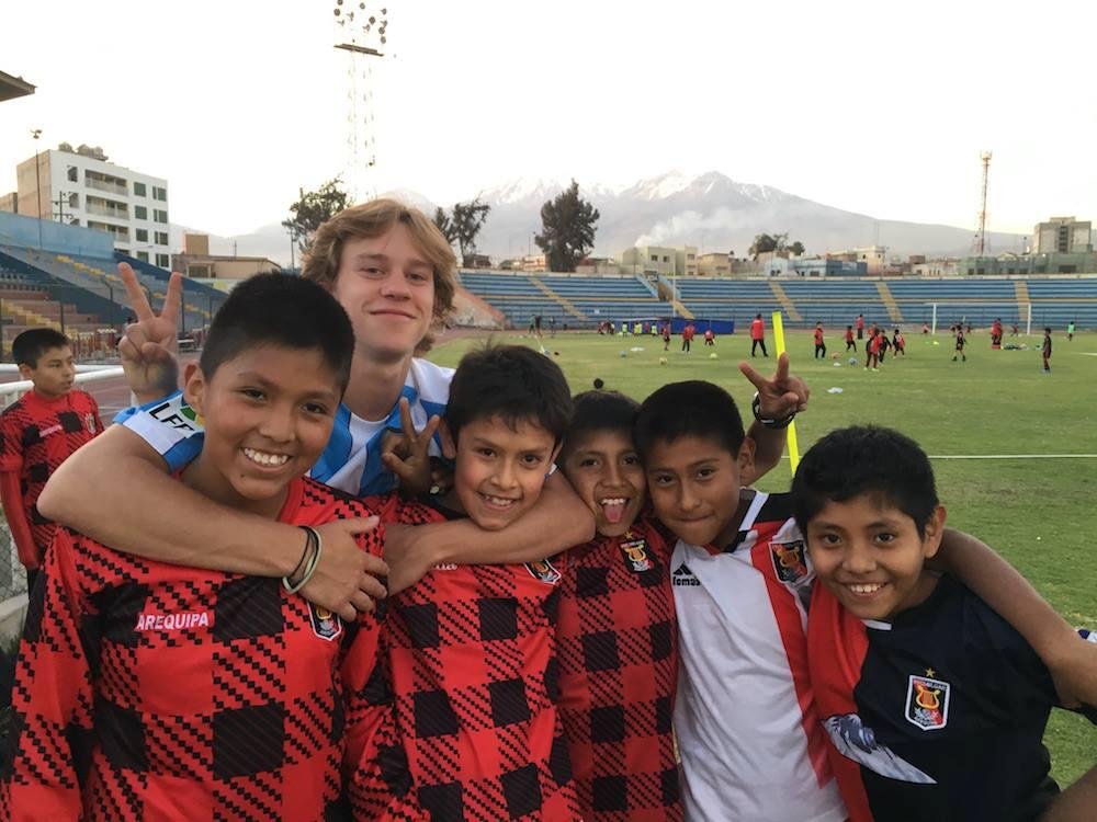 Casey, in Peru playing soccer with those his age and working with the youngers.