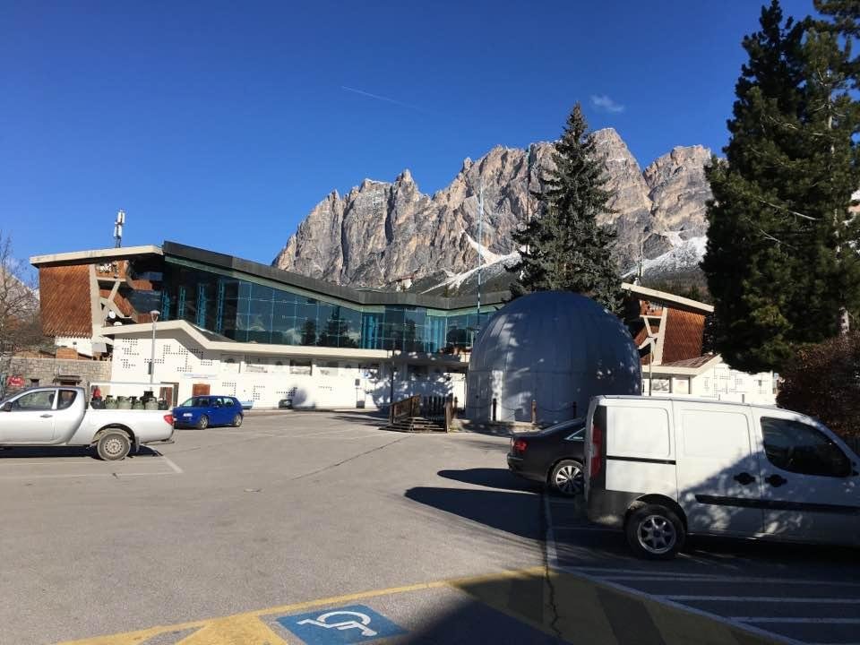 Greetings from Cortina! 1956 Winter Olympics held here. This is the Ice Skating and Hockey Stadium. Years ago it was not enclosed, like in the scene from the best James Bond movie “For Your Eyes Only”. Paola having minor fo