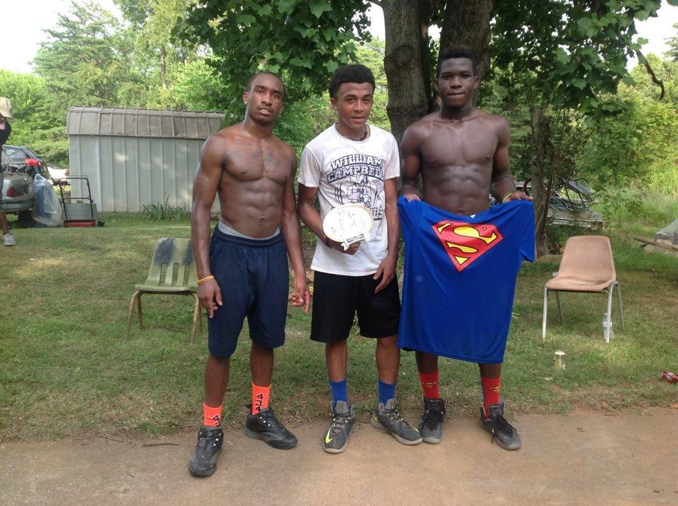 Winners of Miller-Banks Family Reunion Basketball Tournament displaying trophy. Much love, much fun!!!