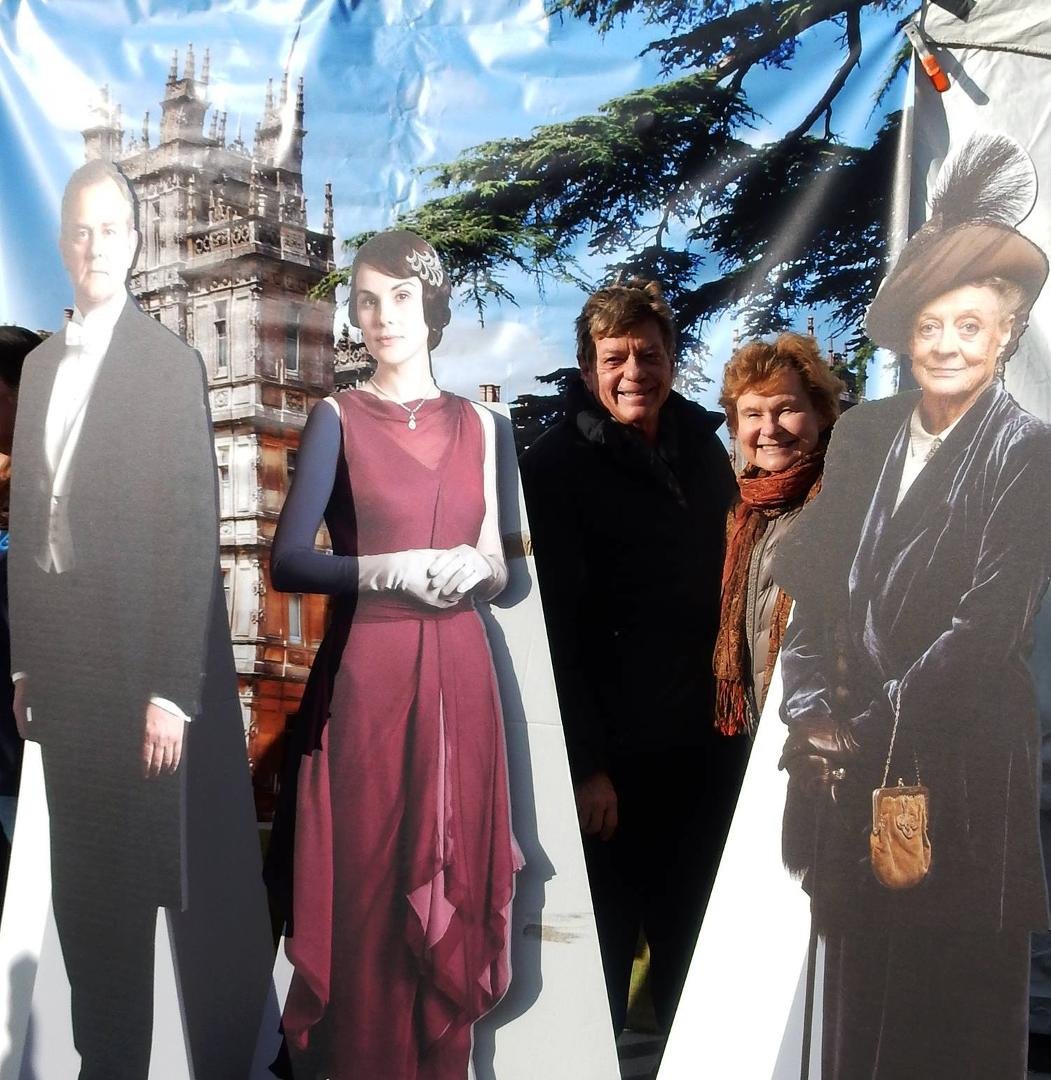 Diane and Michael popping out from a display of our favorite PBS series:  Downton Abbey ... whose float was the beautiful castle  in an English garden setting.