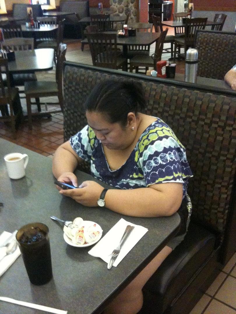 My beautiful wife waiting for breakfast Iowa 80 world's largest truck stop and then to the Casino and back on the road.