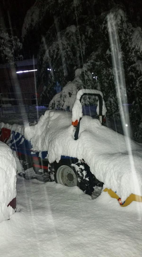 My Massey Ferguson I was out clearing snow off our driveway with until noon today is buried now!!