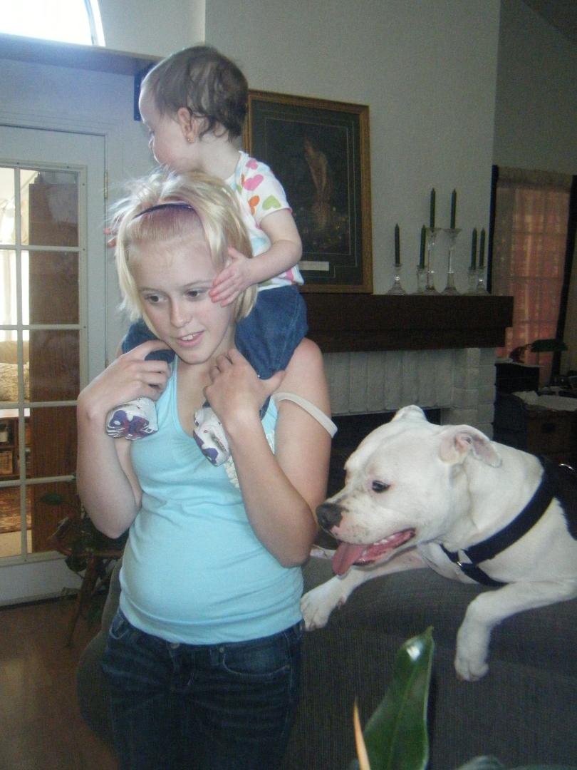 Caysee riding on Aunt Katie's shoulders. Maggie wants to know when is it her turn.