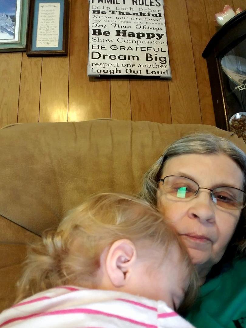 This little sweetie wasn't tired of laying down but wasn't done with her nap.